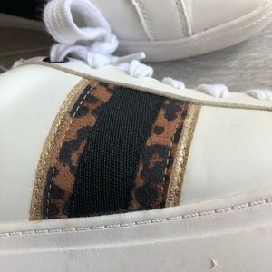 White sneakers with leopard print on the side